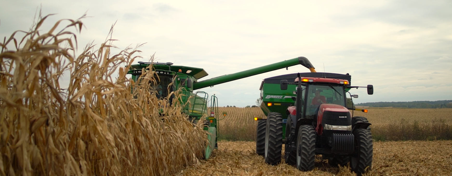 combine and tractor with grain cart